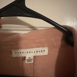 Pink button down shirt. Never been worn